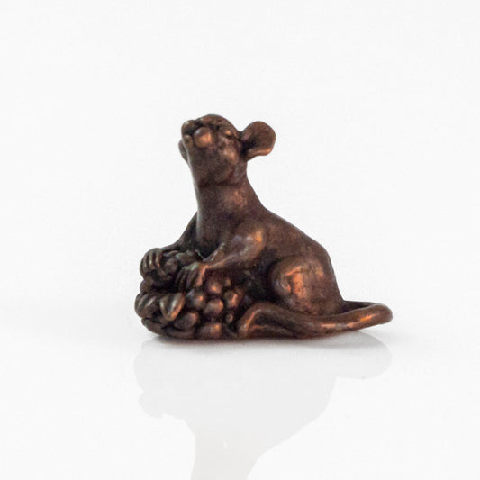 Bronze mouse with berry