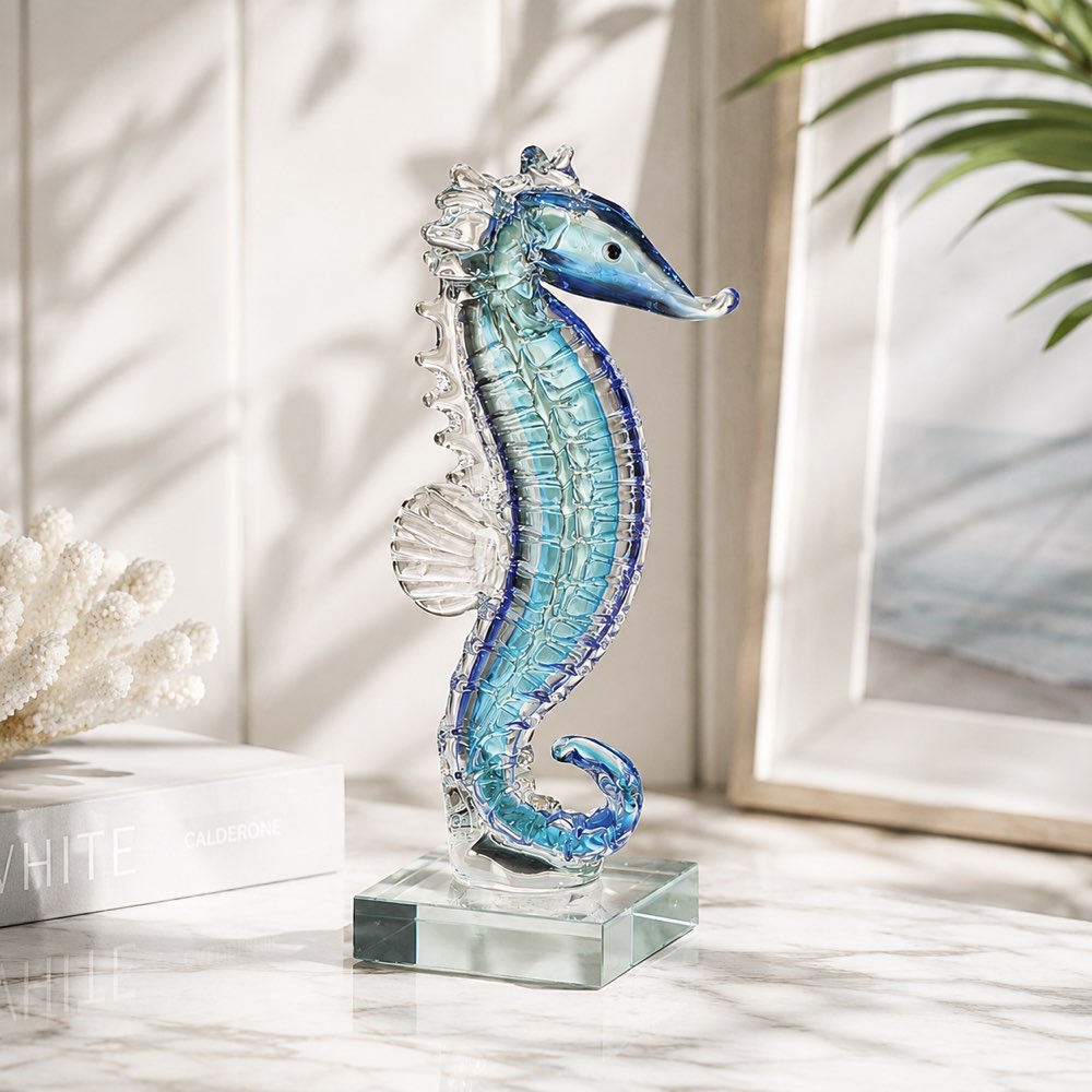 Decorative glass seahorse on a clear base with a light background