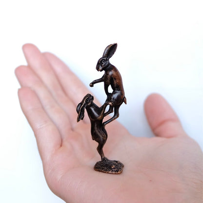 Hares boxing in bronze.