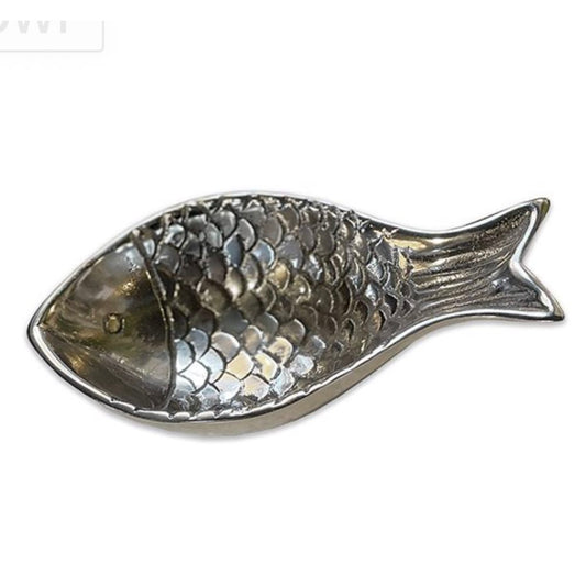 Fish-shaped metal dish on a white background