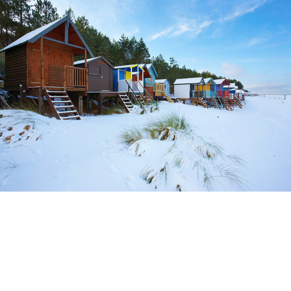 Wells-next-the-Sea Beach Huts in the Snow by Jon Gibbs