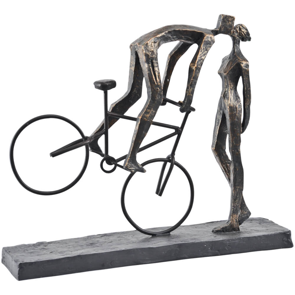 Bronze sculpture of a cyclist on a bike embracing their partner 