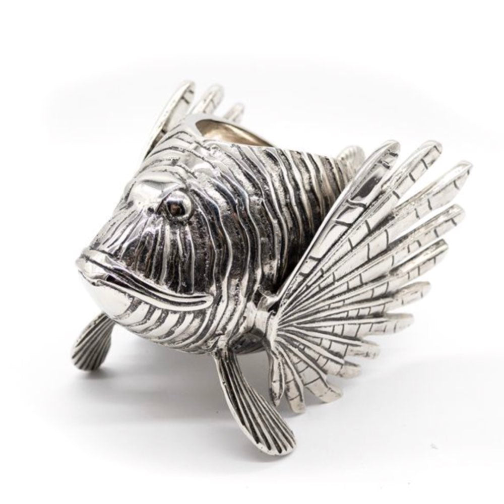 Silver fish-shaped object on a white background