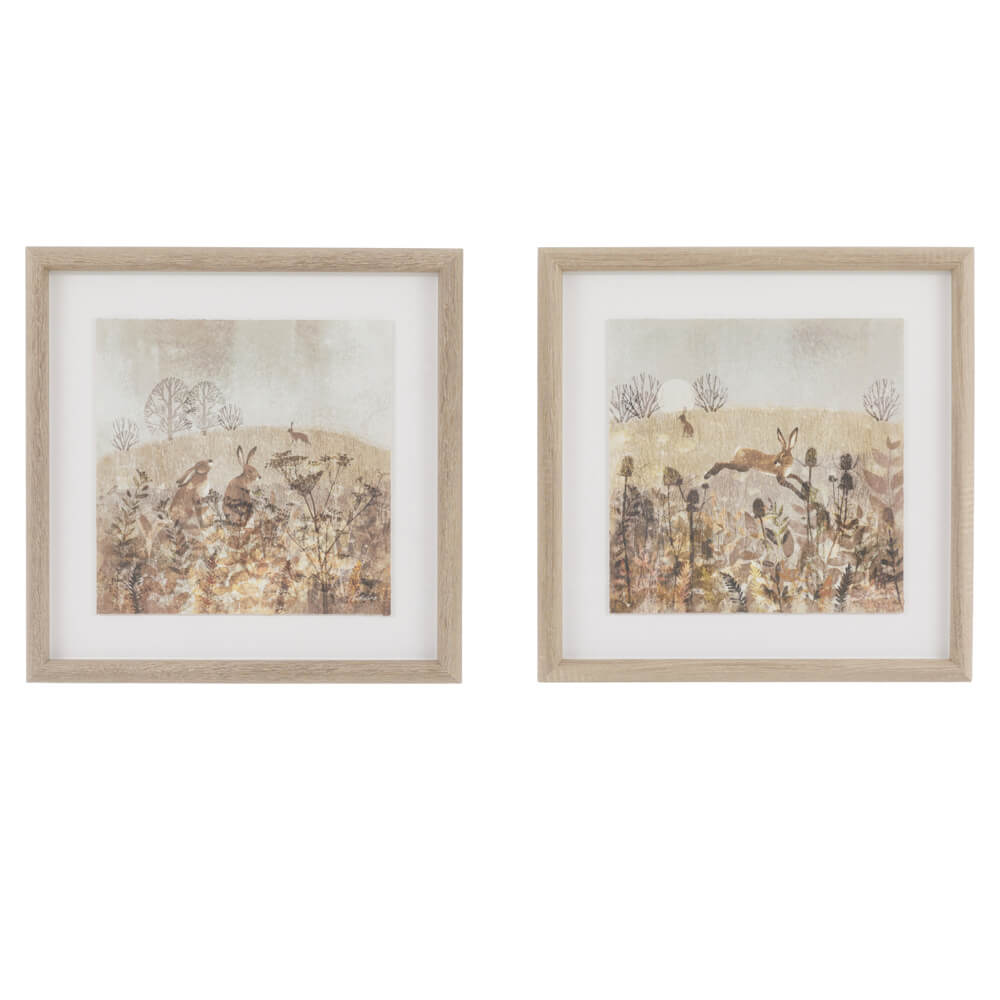 Meadow Mischief wall art with hares in the countryside, framed in weathered oak for rustic interiors