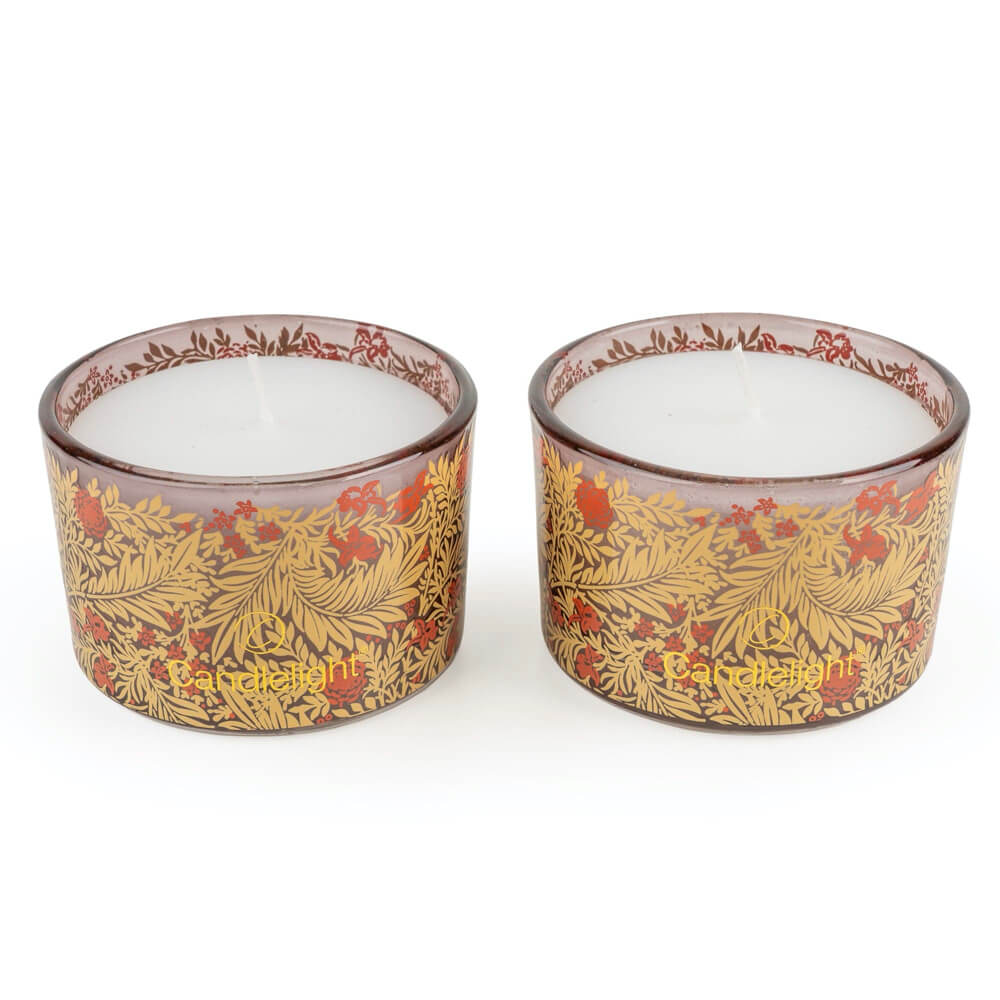 Two glass candle holders with floral design and 'Candlelight' branding on a white background