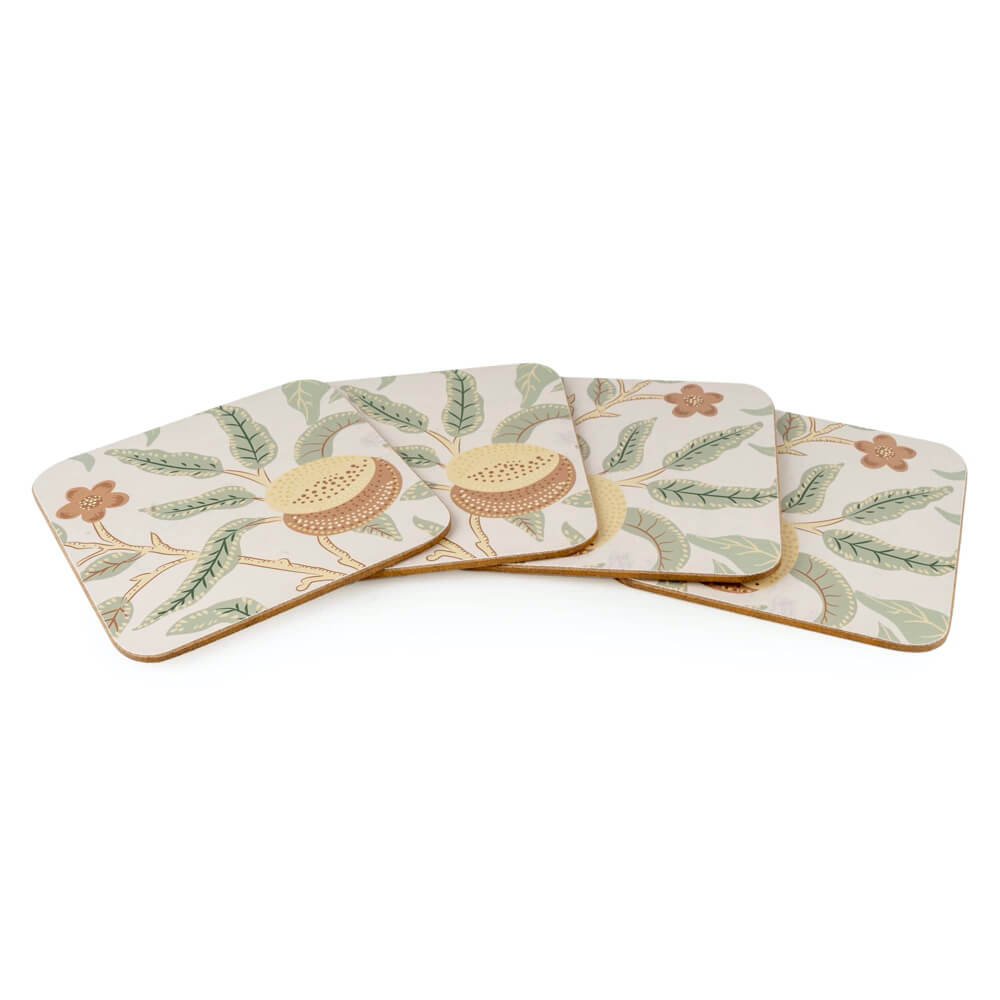 Set of four coasters with floral design on a white background