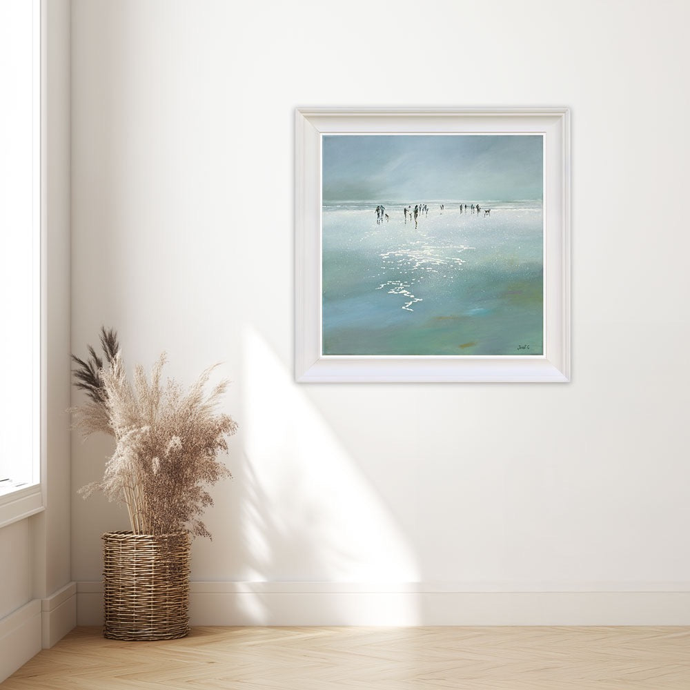 Framed artwork of a beach scene.