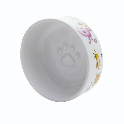 White ceramic pet bowl with decorative edge and paw print on a white background
