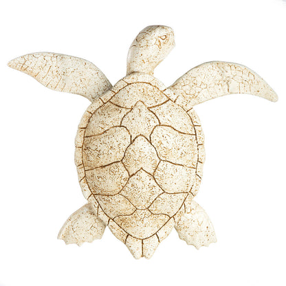 Decorative turtle figure with a textured shell on a white background