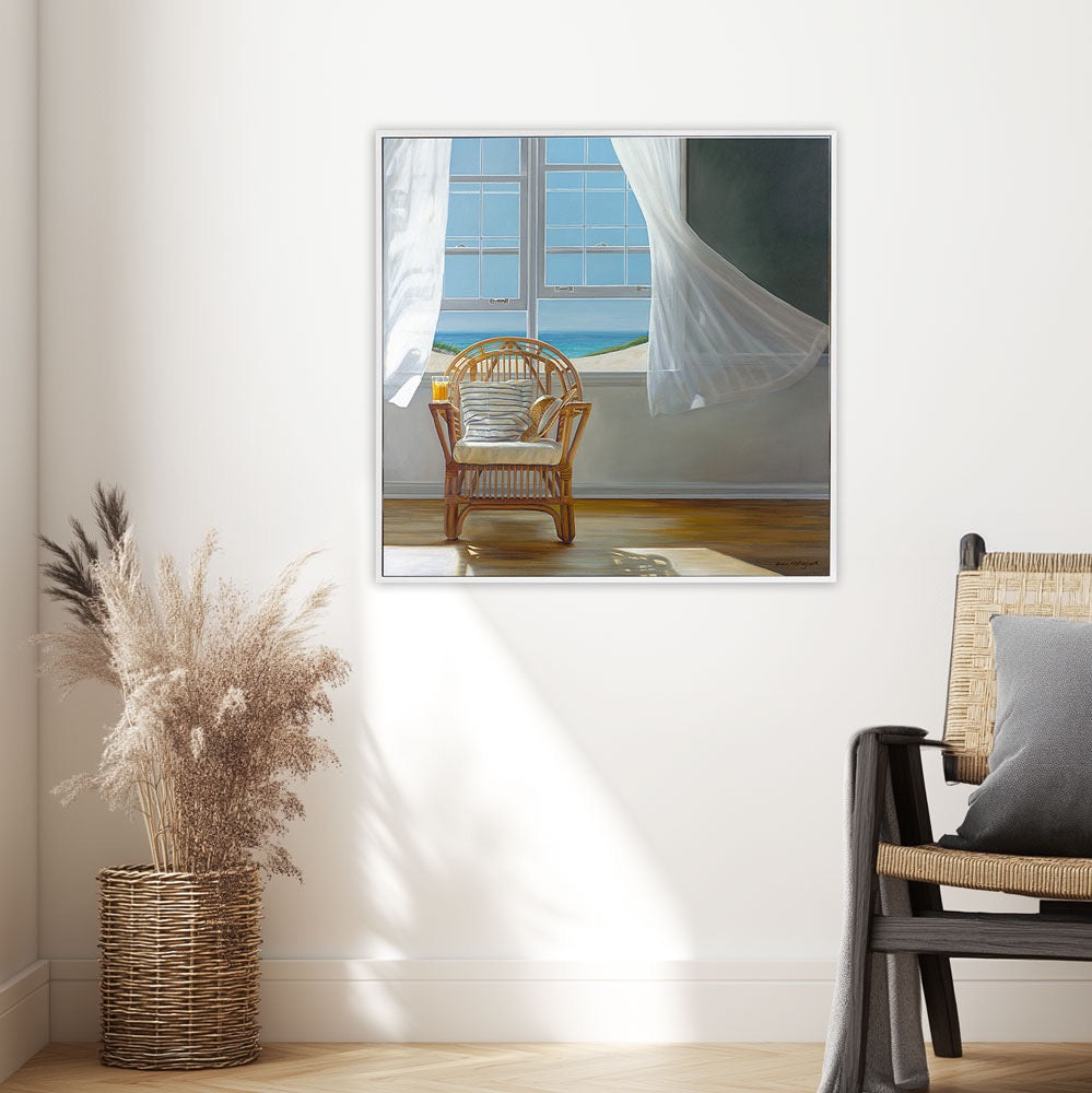 Framed artwork of a room with a chair and window, placed on a wall above a vase with dried plants.
