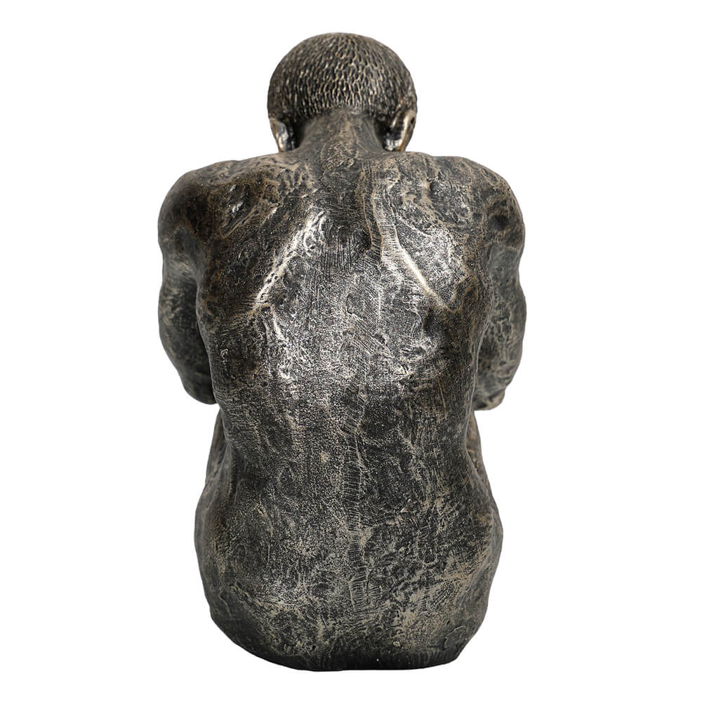 The Contemplating Man Sculpture in dark bronze-effect finish, seated male figure with head bowed and arms around knees