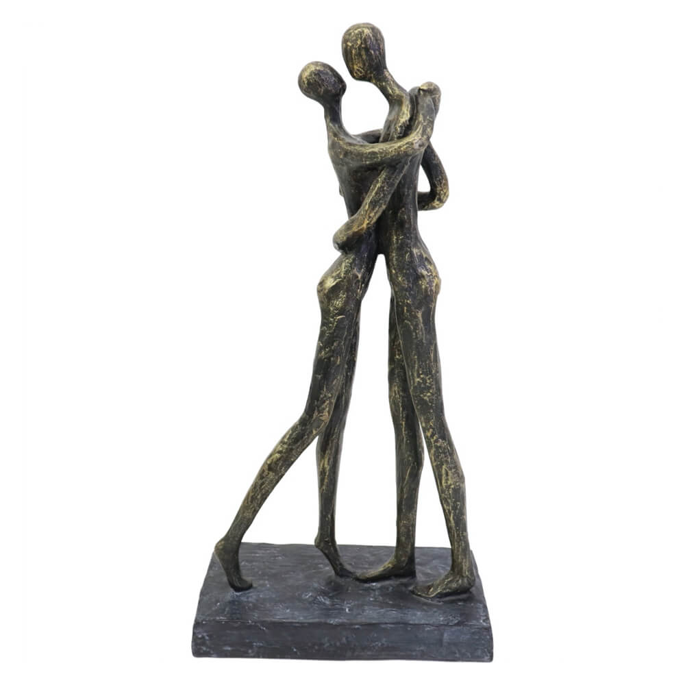 Bronze sculpture of two people embracing on a white background