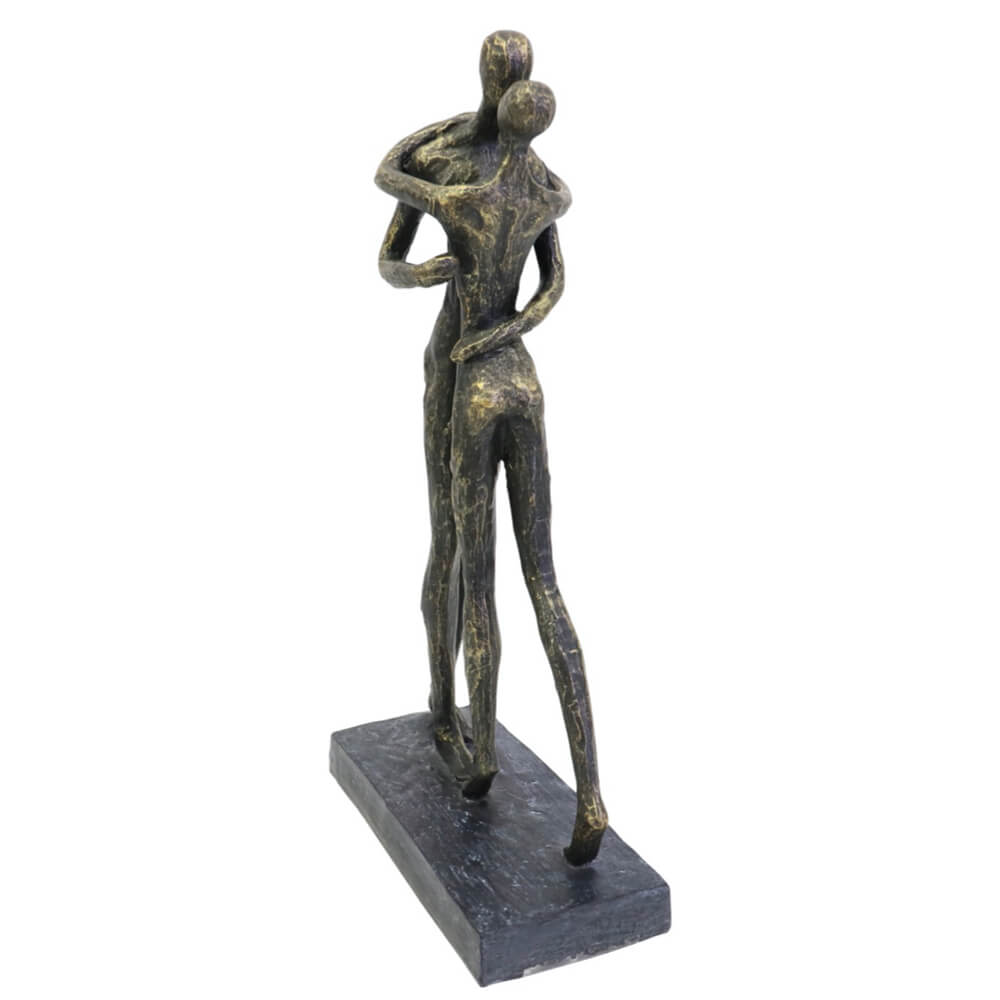 Bronze sculpture of two abstract figures on a white background