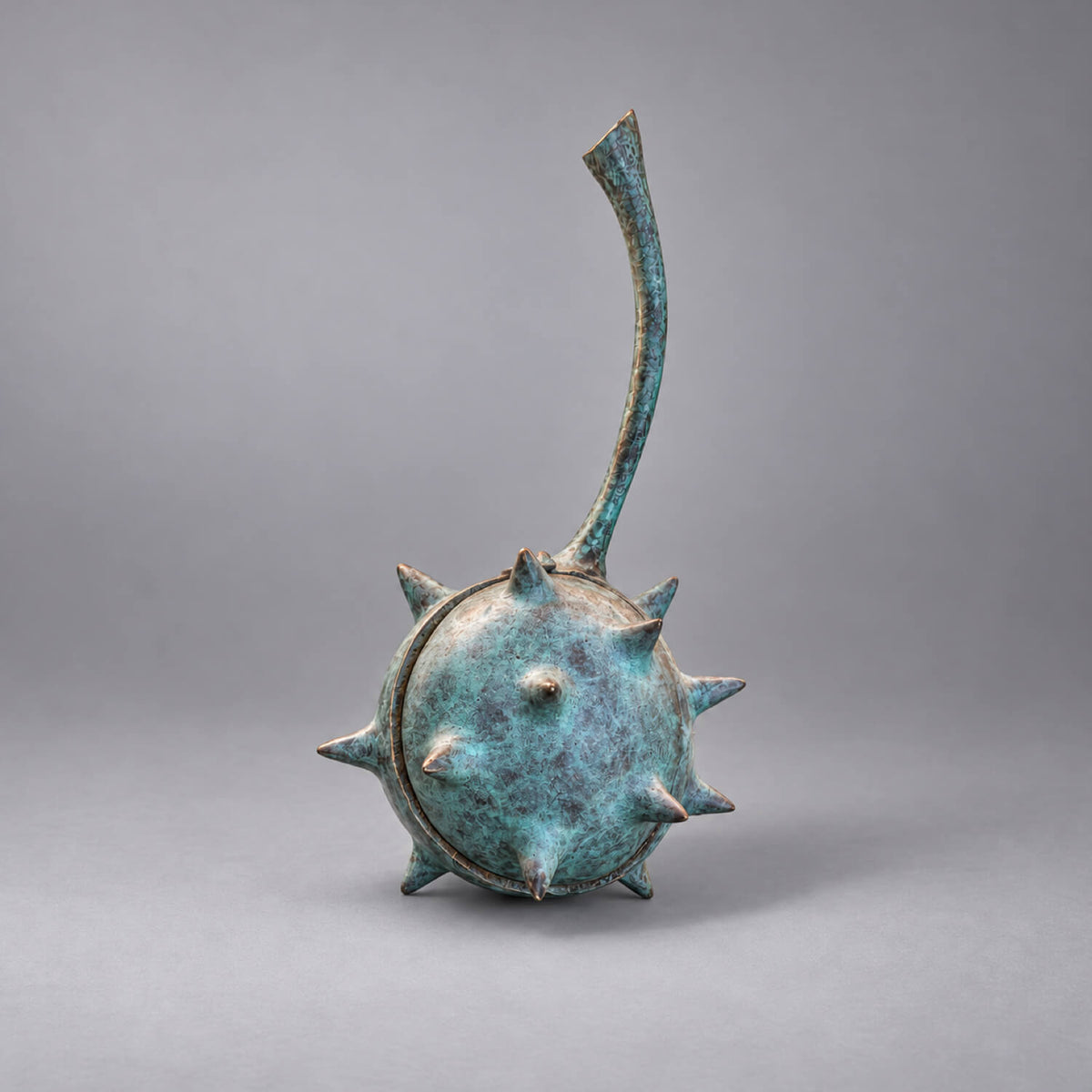 Two Mice in a Conker bronze sculpture by David Meredith with its spiked verdigris lid closed and curved stem visible.