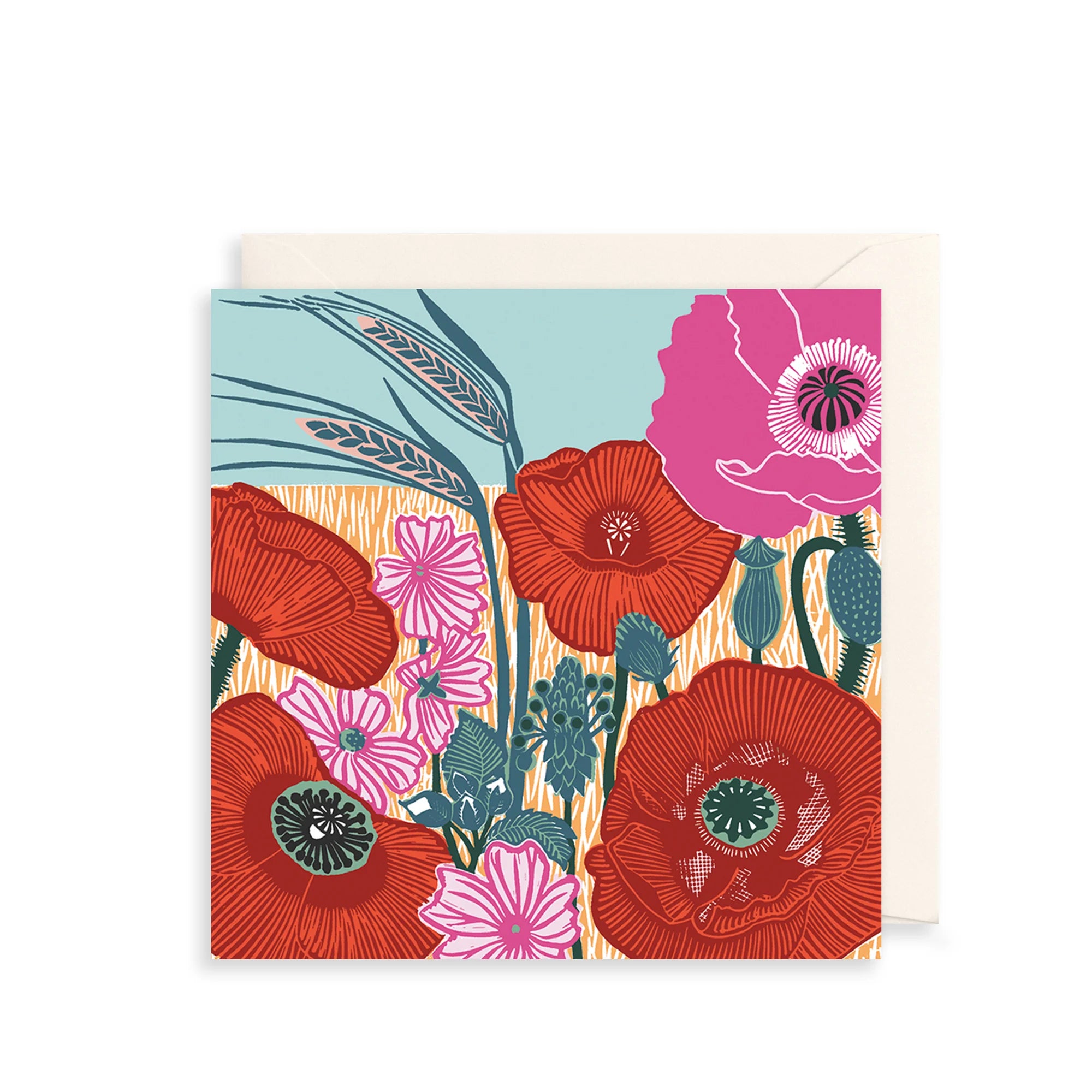 A square greeting card with a colorful floral illustration featuring red poppies, pink flowers, teal leaves, and wheat stalks, shown with a cream envelope behind it on a white background.