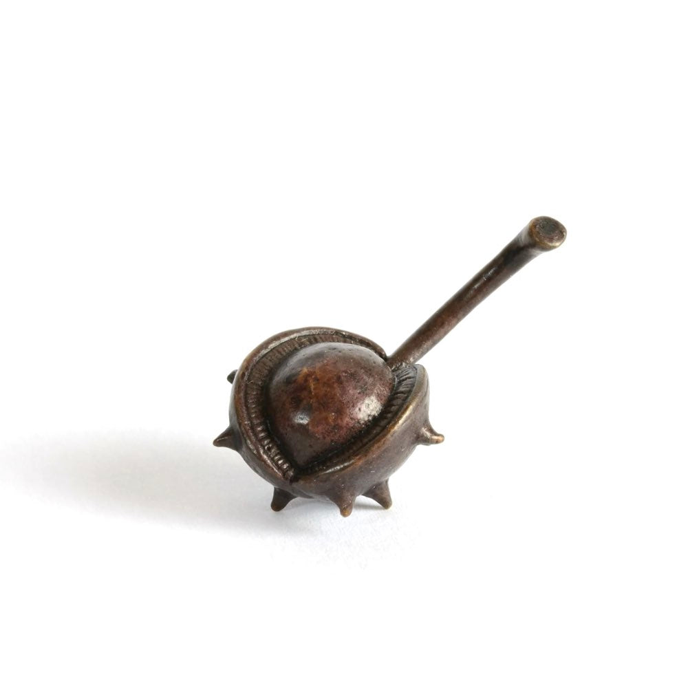 Small bronze sculpture of a conker in shell 
