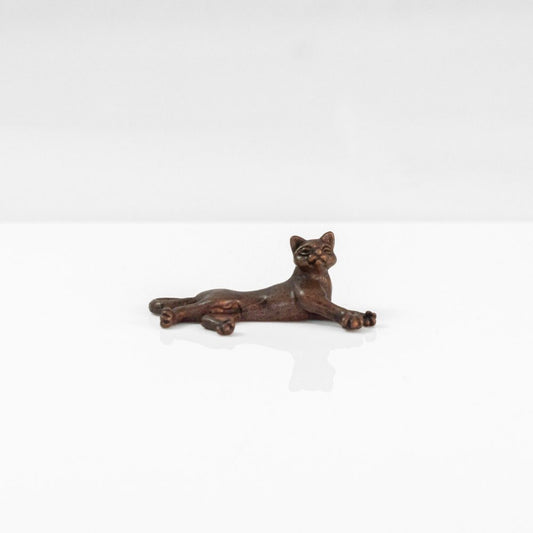 Miniature bronze laying cat 