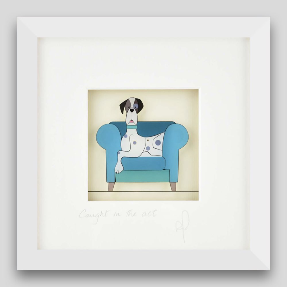 Framed print of a dog caught sitting on the sofa 