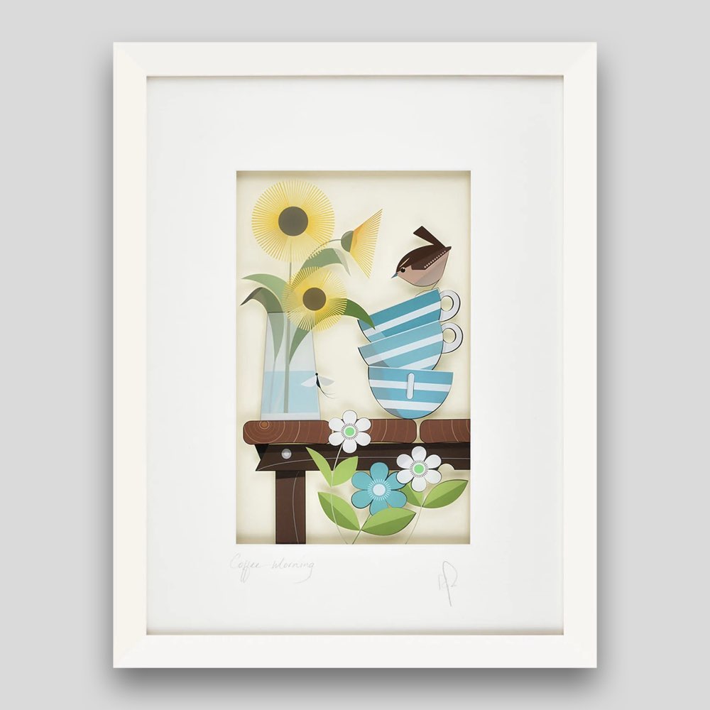 Framed illustrative print of a wren sitting on coffee cups, with sunflowers in vase 